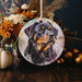 a ceramic ornament with a picture of a dog on it