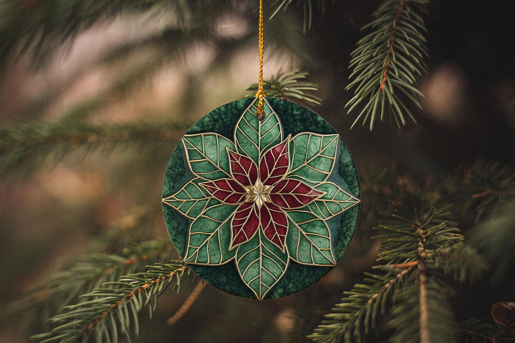 a green and red ornament hanging from a tree