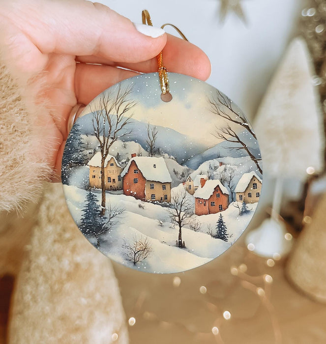 a person holding a christmas ornament in their hand