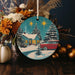 a christmas ornament with a red car in front of a house