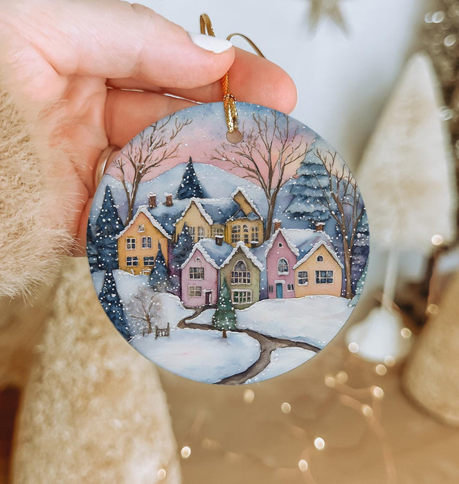 a person holding a christmas ornament in their hand