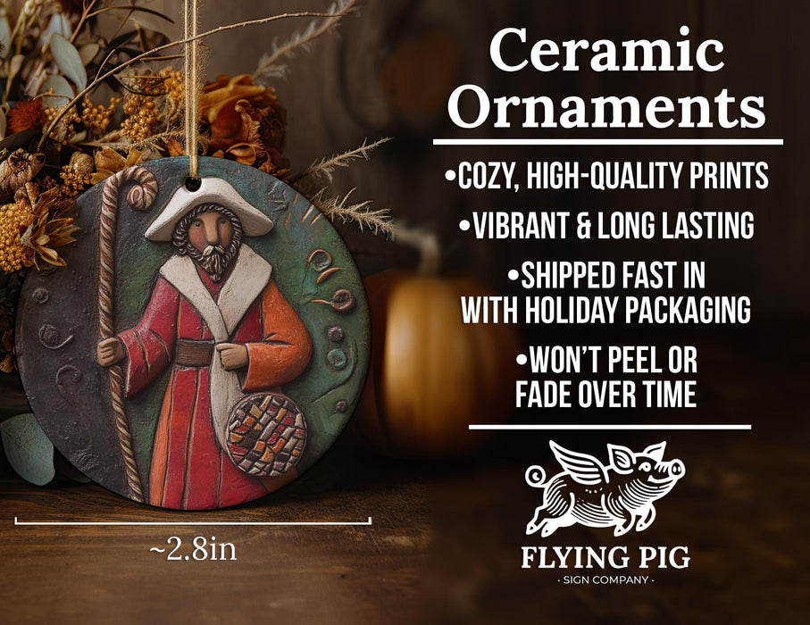 a ceramic ornament with a picture of a man holding a staff
