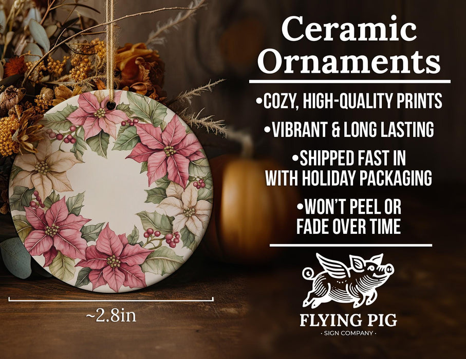 a ceramic ornament with poinsettis on it