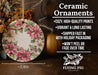 a ceramic ornament with poinsettis on it