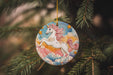 a christmas ornament hanging from a tree