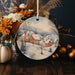 a ceramic ornament with a winter scene on it