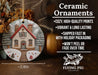 a ceramic ornament with a house on it