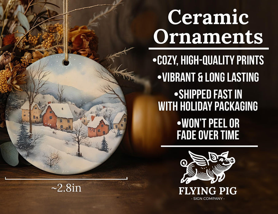 a ceramic ornament with a snowy village scene