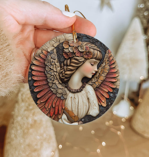 a person holding a christmas ornament in their hand