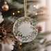 a christmas ornament hanging from a christmas tree