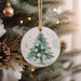 a christmas tree ornament hanging from a christmas tree