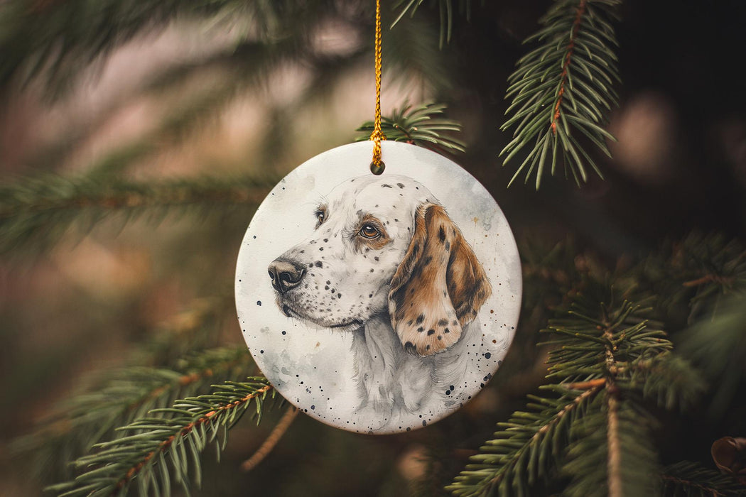 a white and brown dog ornament hanging from a christmas tree