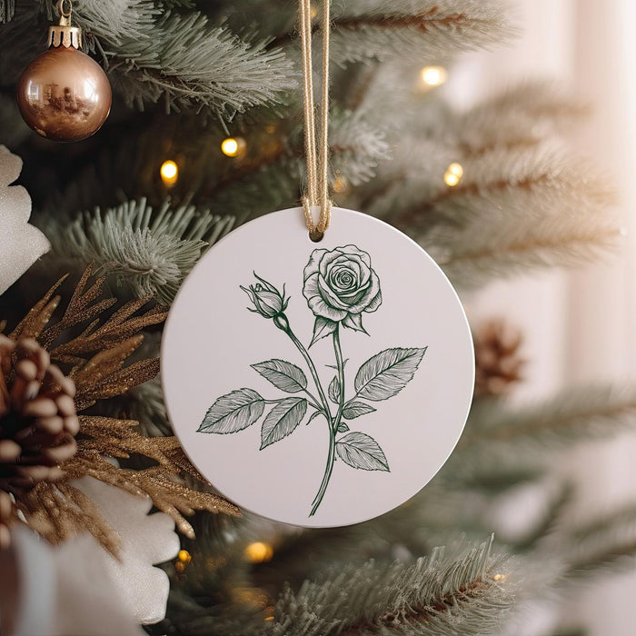 a white ornament hanging from a christmas tree