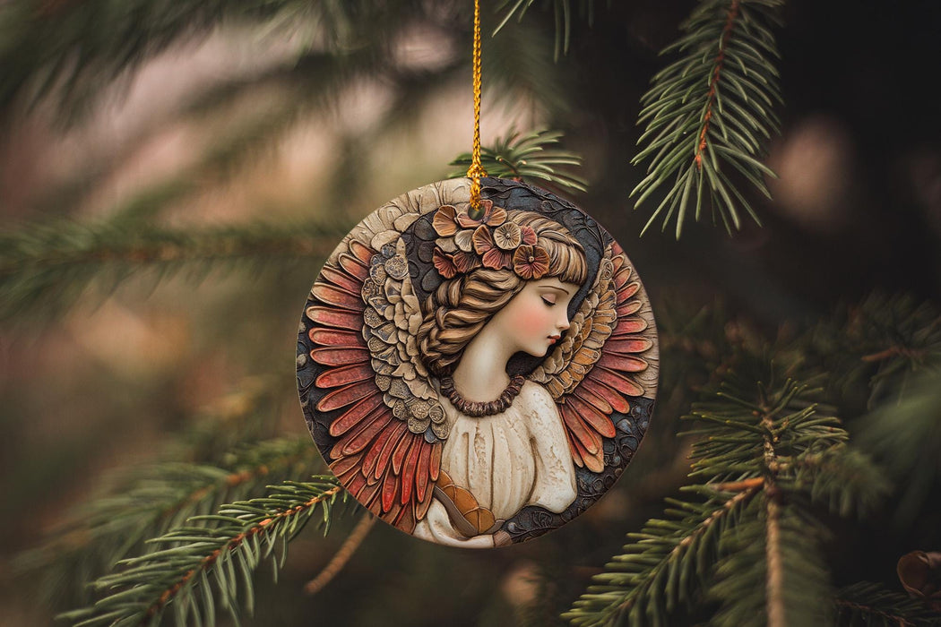 a ceramic angel ornament hanging from a pine tree
