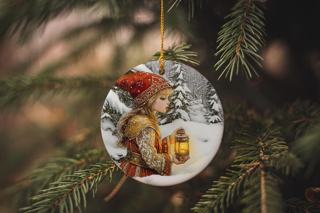 a glass ornament hanging from a christmas tree