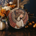 a ceramic ornament with a woman's face on it