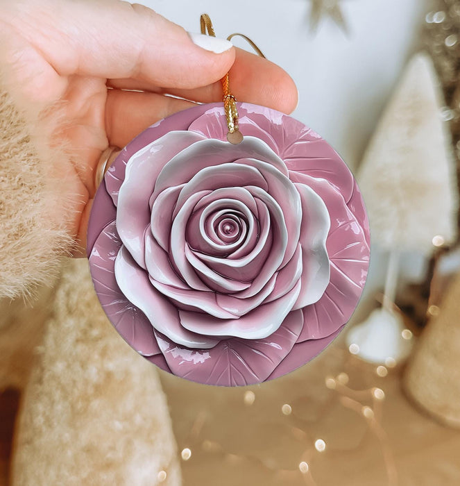 a person holding a purple flower ornament in their hand