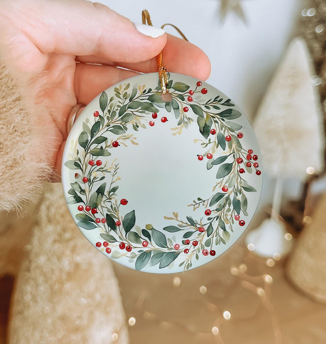 a person holding a christmas ornament in their hand