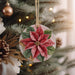 a christmas ornament hanging from a christmas tree