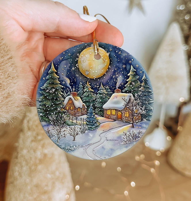 a person holding a christmas ornament in their hand