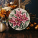 a ceramic ornament decorated with flowers and leaves