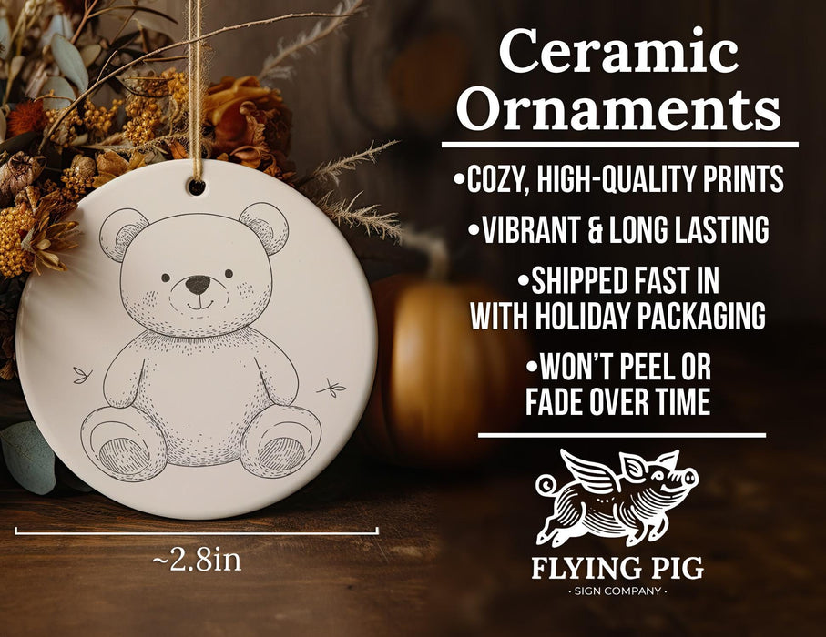 a ceramic ornament with a picture of a teddy bear