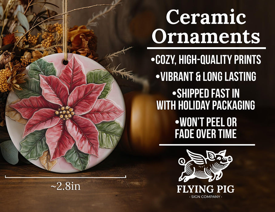 a ceramic ornament with a poinsetti on it