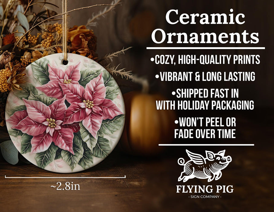 a ceramic ornament with a pink flower on it