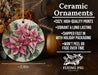 a ceramic ornament with a pink flower on it