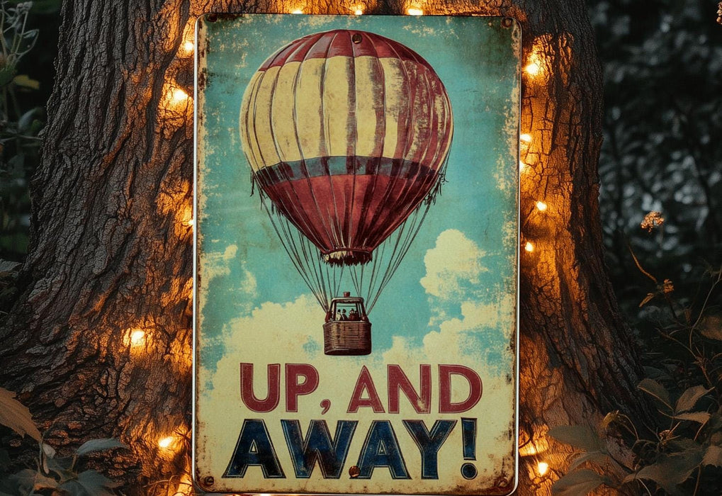 a sign that says up and away with a hot air balloon