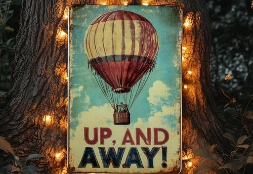 a sign that says up and away with a hot air balloon