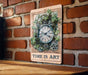a picture of a clock on a brick wall