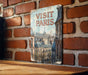 a sign on a brick wall that says visit paris