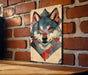 a picture of a wolf on a brick wall