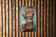 a painting of a girl and a boy standing on top of a stack of books