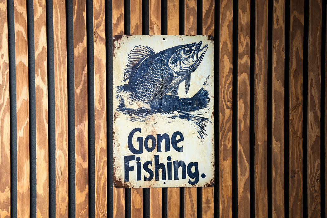 a gone fishing sign on a wooden wall