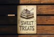 a sign that says sweet treats on it