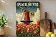 a painting of a windmill in a field of tulips