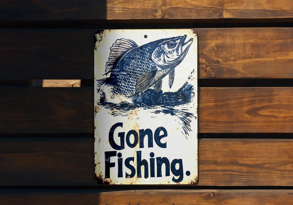 a gone fishing sign hanging on a wooden wall