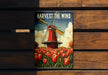 a poster of a windmill in a field of tulips