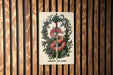 a picture of a red snake on a wooden wall