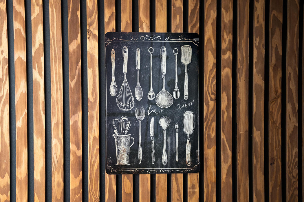 a wooden wall with spoons and measuring spoons on it