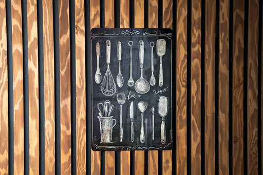 a wooden wall with spoons and measuring spoons on it