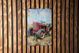 a painting of a red tractor on a wooden wall