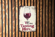 a sign with a glass of wine on it