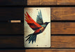 a bird painted on the side of a wooden bench
