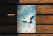 a picture of a bird on a wooden bench