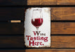 a sign with a glass of wine on it