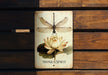 a picture of a dragonfly sitting on top of a flower