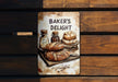 a sign that says baker's delight on it